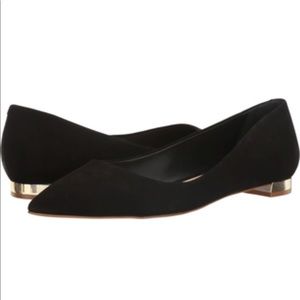 Black suede pointed toe flats with gold heel